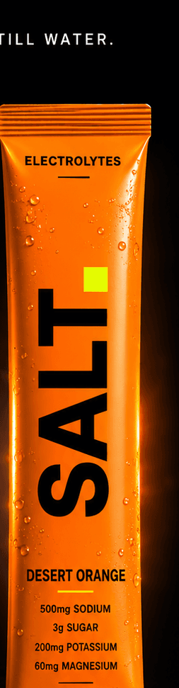 SALT Desert Orange sachet — vivid orange pack on a dark stage, 500mg sodium, 3g sugar per serve.