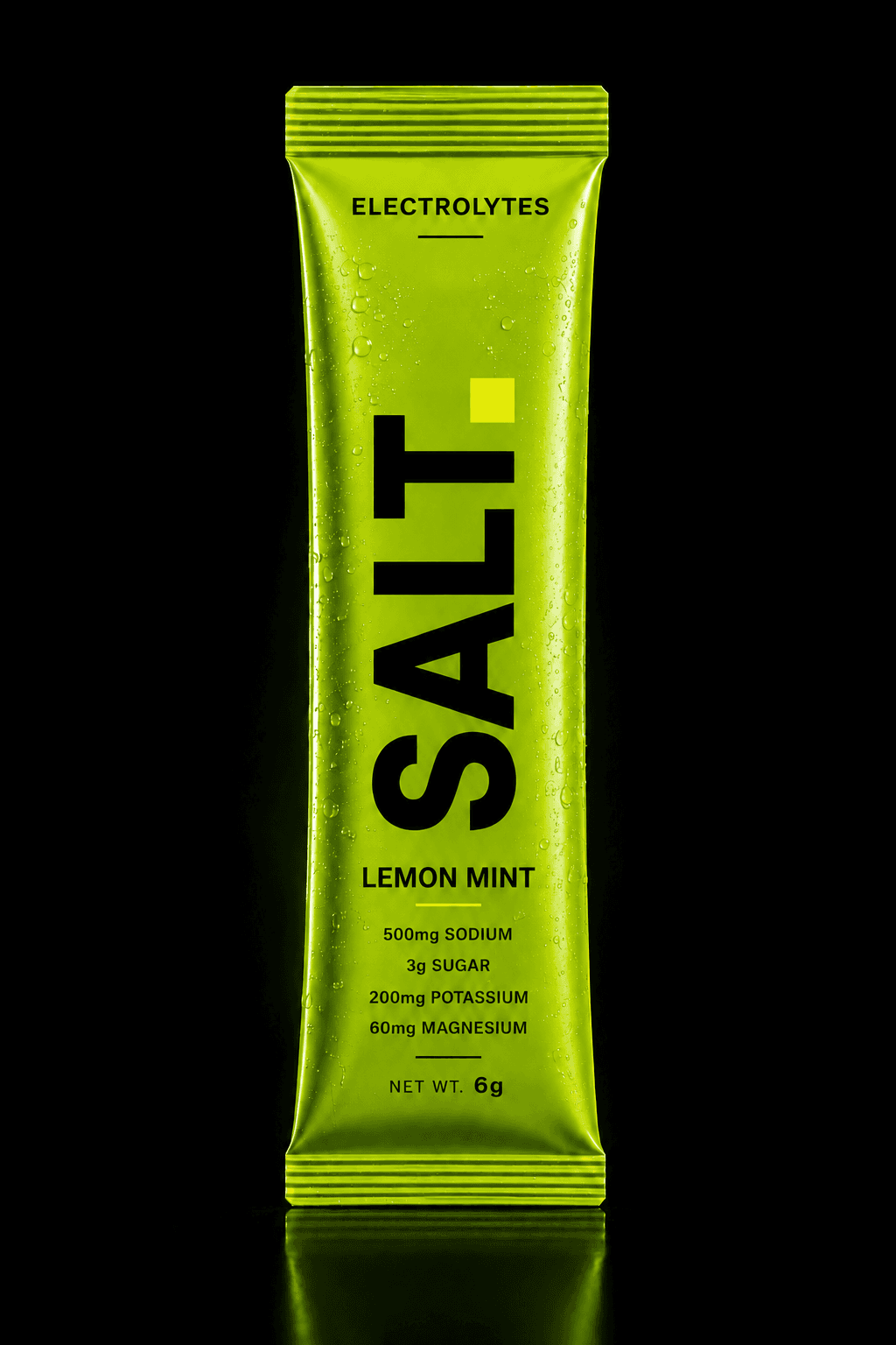 SALT Lemon Mint sachet — vivid green pack on a dark stage, 500mg sodium, 3g sugar per serve.